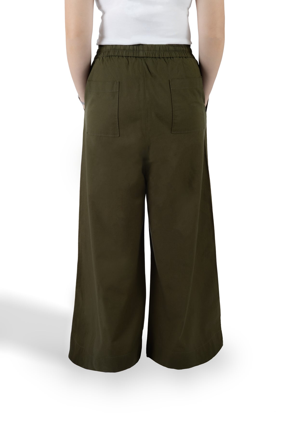 A person shown from the back wearing wide-leg olive green pants with an elastic waistband and two large back patch pockets, paired with a white top against a plain white studio background.
