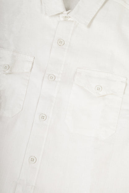 Close-up of a white long-sleeve button-up shirt showing the collar, front buttons, and left chest pocket.