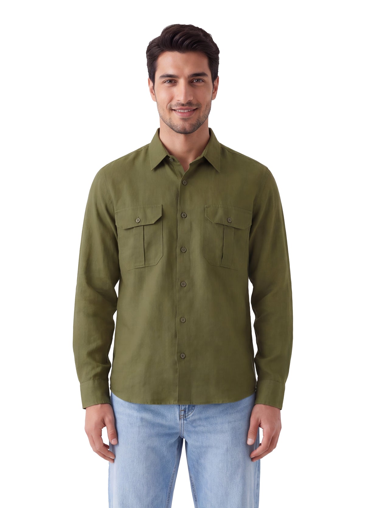 A man wearing an olive green long-sleeve button-up shirt with two chest pockets and light blue jeans, standing against a plain white background.