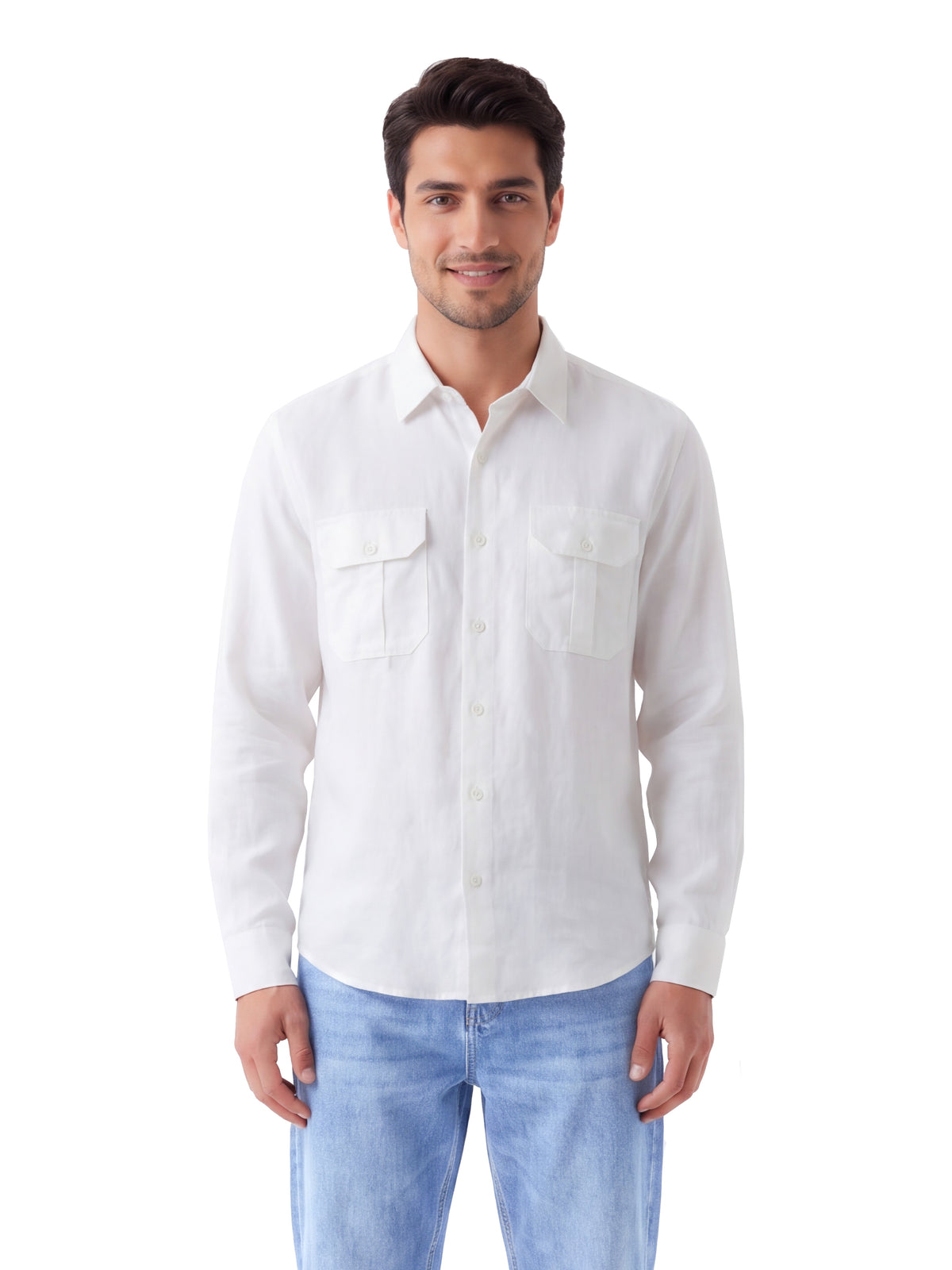 A man wearing a white long-sleeve button-up shirt with two chest pockets and light blue jeans, standing against a plain white background.