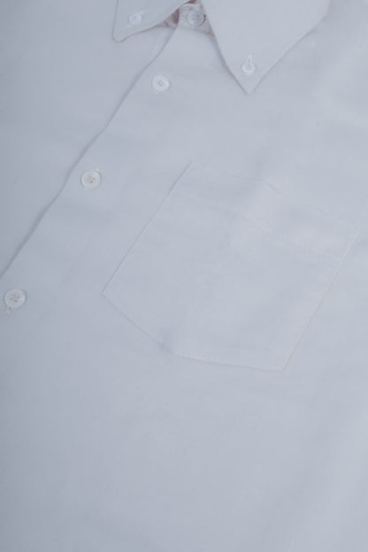 Close-up of a white long-sleeve button-down shirt showing the collar, front buttons, and chest pocket.